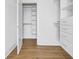 Bright walk-in closet with built-in shelving and additional storage at 305 Matilda St, Edisto Beach, SC 29438