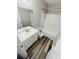 Clean bathroom with white vanity, bathtub, and gray-toned hardwood floors at 319 Bradley Bend Dr, Moncks Corner, SC 29461