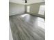 Large bedroom with gray walls and gray-toned hardwood floors at 319 Bradley Bend Dr, Moncks Corner, SC 29461