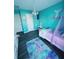 Charming bedroom with teal walls, a mermaid theme, and a comfy bed at 319 Bradley Bend Dr, Moncks Corner, SC 29461