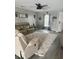 Spacious living room with gray walls, hardwood floors, and a large sectional sofa at 319 Bradley Bend Dr, Moncks Corner, SC 29461
