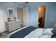 Serene bedroom with light blue walls and access to bathroom at 3701 Docksite Rd # 320, Edisto Beach, SC 29438