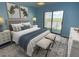 Bright bedroom with water views and sliding glass door to balcony at 3701 Docksite Rd # 320, Edisto Beach, SC 29438