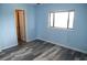 Charming bedroom with light blue walls and wood-look floors at 3701 Docksite Rd # 320, Edisto Beach, SC 29438