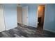 Light and airy bedroom with wood-look floors and access to a bathroom at 3701 Docksite Rd # 320, Edisto Beach, SC 29438