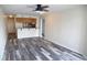 Open concept living area with hardwood floors and access to kitchen at 3701 Docksite Rd # 320, Edisto Beach, SC 29438