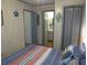 Bedroom with access to bathroom and closet at 506 Jungle Rd, Edisto Island, SC 29438