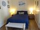 Bedroom with a double bed, nightstands, and beach decor at 506 Jungle Rd, Edisto Island, SC 29438