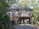 Charming elevated cottage with a large deck at 506 Jungle Rd, Edisto Island, SC 29438
