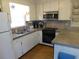 Efficient kitchen featuring granite counters and appliances at 506 Jungle Rd, Edisto Island, SC 29438