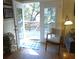 Living room with access to deck, hardwood floors, and comfy seating at 506 Jungle Rd, Edisto Island, SC 29438
