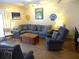 Spacious living area featuring sectional sofa and wood floors at 506 Jungle Rd, Edisto Island, SC 29438