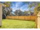 Spacious backyard with a wooden fence and grassy lawn at 5259 Hartford Cir, North Charleston, SC 29405