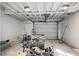 Unfinished basement with exposed ceiling beams and a garage door at 5259 Hartford Cir, North Charleston, SC 29405
