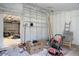 Partially finished basement with built-in shelving at 5259 Hartford Cir, North Charleston, SC 29405