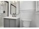 Modern bathroom with gray vanity, marble shower, and black accents at 5259 Hartford Cir, North Charleston, SC 29405