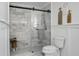 Bathroom with marble shower and white toilet at 5259 Hartford Cir, North Charleston, SC 29405