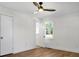 Bedroom featuring hardwood floors, ceiling fan, and exterior access at 5259 Hartford Cir, North Charleston, SC 29405