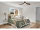 Bedroom with light green bedding and ceiling fan at 5259 Hartford Cir, North Charleston, SC 29405