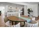 Open concept dining area with a large table and a view into the updated kitchen at 5259 Hartford Cir, North Charleston, SC 29405