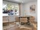 Spacious dining area with hardwood floors, a round table, and ample natural light from large windows at 5259 Hartford Cir, North Charleston, SC 29405