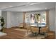 Light-filled dining room with a round table and chairs, adjacent to the kitchen at 5259 Hartford Cir, North Charleston, SC 29405