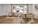 Modern dining room with hardwood floors and a view into the updated kitchen at 5259 Hartford Cir, North Charleston, SC 29405