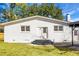 Rear view of house with white brick and covered patio at 5259 Hartford Cir, North Charleston, SC 29405