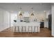 White kitchen with island, stainless steel appliances, and marble backsplash at 5259 Hartford Cir, North Charleston, SC 29405
