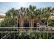 View of a charming backyard oasis with lush greenery and palm trees at 99 Tradd St, Charleston, SC 29401