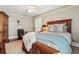 Bedroom with wooden bed frame and ceiling fan at 99 Tradd St, Charleston, SC 29401