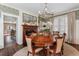 Elegant dining room with round table and chandelier at 99 Tradd St, Charleston, SC 29401