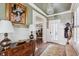 Elegant entryway with hardwood floors, decorative elements, and view to dining room at 99 Tradd St, Charleston, SC 29401