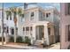 Charming two-story home with gray facade, white trim, and landscaping at 99 Tradd St, Charleston, SC 29401