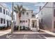 Gray house with a white porch and palm tree at 99 Tradd St, Charleston, SC 29401