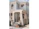 Two-story gray house with white columns at 99 Tradd St, Charleston, SC 29401