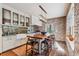 Modern kitchen with white cabinets, granite countertops, and center island at 99 Tradd St, Charleston, SC 29401