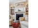Living room with fireplace, built-in shelving, and comfortable seating at 99 Tradd St, Charleston, SC 29401