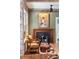 Cozy sitting area with fireplace and exposed brick at 99 Tradd St, Charleston, SC 29401