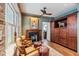 Cozy sitting area with fireplace and exposed brick at 99 Tradd St, Charleston, SC 29401