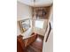 View of an elegant wooden staircase from above at 99 Tradd St, Charleston, SC 29401