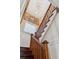 Elegant wooden staircase with chandelier and ornate details at 99 Tradd St, Charleston, SC 29401