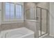 Main bathroom with soaking tub and walk-in shower at 9991 Winged Elm St, Ladson, SC 29456