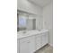 Bathroom with double vanity, large mirror, and separate shower at 9991 Winged Elm St, Ladson, SC 29456