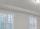 Bright bedroom with white walls and plantation shutters at 9991 Winged Elm St, Ladson, SC 29456