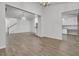 Open concept dining room with hardwood floors and views into kitchen and living areas at 9991 Winged Elm St, Ladson, SC 29456