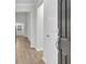 Bright entryway with hardwood floors and neutral-colored walls at 9991 Winged Elm St, Ladson, SC 29456