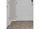Hardwood floor entryway with white door and neutral walls at 9991 Winged Elm St, Ladson, SC 29456
