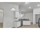 Eat-in kitchen with granite countertops and white cabinetry at 9991 Winged Elm St, Ladson, SC 29456