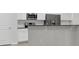 Modern kitchen with white cabinets, stainless steel appliances, and granite countertops at 9991 Winged Elm St, Ladson, SC 29456